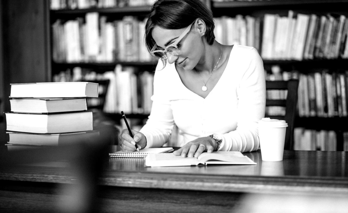 Financial analyst reviewing complex market data and forecasting models on multiple computer screens